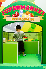 Image showing Children role-playing at vege store.