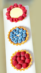 Image showing fruit tartlets with raspberries and blueberries 