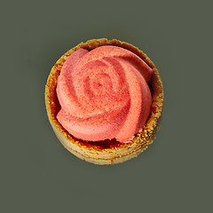 Image showing Home made tartlet rose on wooden background. 