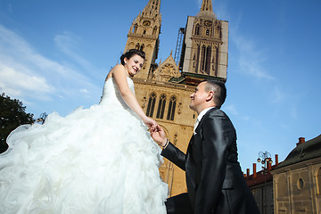 Image showing Newlyweds in front of cathedral