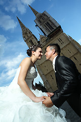 Image showing Groom on knees before bride