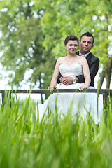 Image showing Married couple on wooden bridge