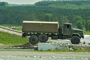 Image showing Curtain sided truck comes through on high obstacle