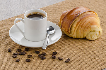 Image showing Cup of black coffee and croissant 