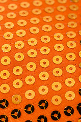 Image showing Orange paillette background
