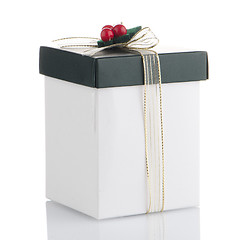 Image showing White and green box with gold bow