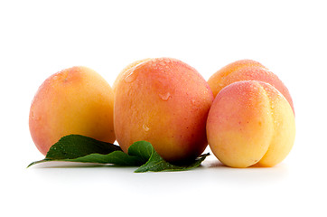 Image showing Sweet peaches with leafs