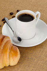 Image showing Cup of black coffee and croissant 