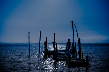 Image showing Old dock moon light reflection