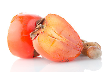 Image showing Ripe persimmons and nuts