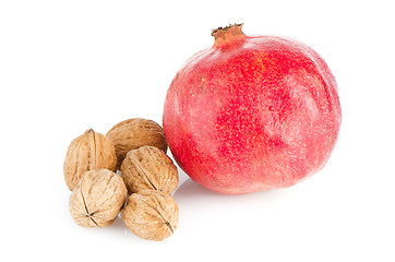 Image showing Ripe pomegranate fruit and nuts