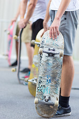 Image showing Boys skateboarding on street. Urban life.
