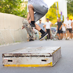 Image showing Boys skateboarding on street. Urban life.