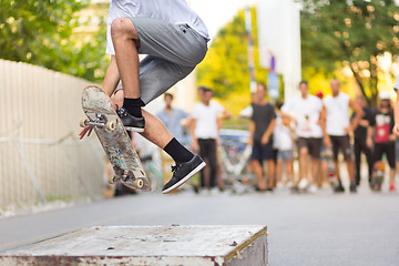 Image showing Boys skateboarding on street. Urban life.