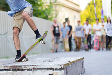 Image showing Boys skateboarding on street. Urban life.