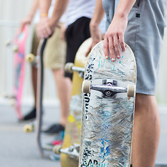 Image showing Boys skateboarding on street. Urban life.