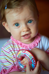 Image showing baby playing with toys at home