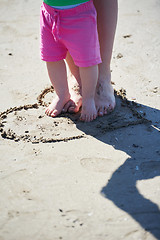 Image showing mom and baby on beach  have fun