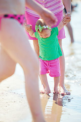 Image showing mom and baby on beach  have fun