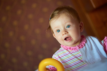 Image showing baby playing with toys at home