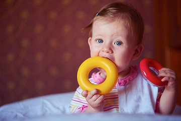 Image showing baby playing with toys at home