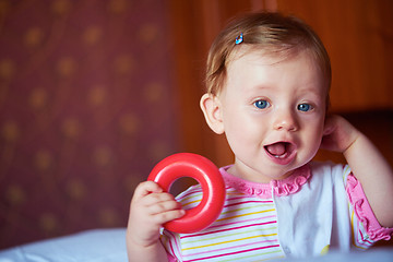 Image showing baby playing with toys at home