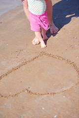 Image showing mom and baby on beach  have fun