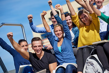 Image showing students outside sitting on steps