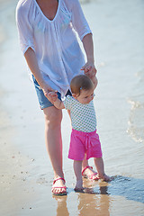 Image showing mom and baby on beach  have fun