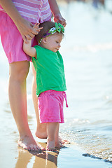 Image showing mom and baby on beach  have fun