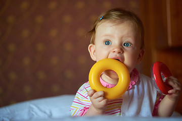 Image showing baby playing with toys at home