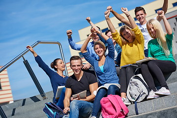 Image showing students outside sitting on steps