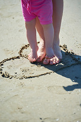 Image showing mom and baby on beach  have fun