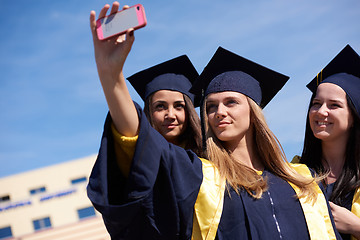 Image showing students group in graduates making selfie