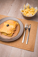 Image showing Francesinha and french fries