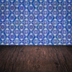 Image showing Wood table top and blur vintage ceramic tile pattern wall