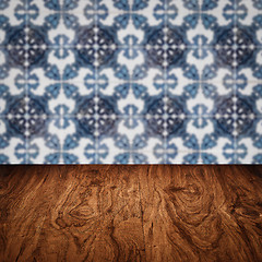 Image showing Wood table top and blur vintage ceramic tile pattern wall