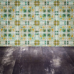 Image showing Wood table top and blur vintage ceramic tile pattern wall