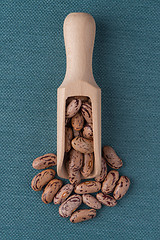 Image showing Wooden scoop with pinto beans