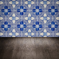 Image showing Wood table top and blur vintage ceramic tile pattern wall