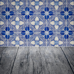 Image showing Wood table top and blur vintage ceramic tile pattern wall