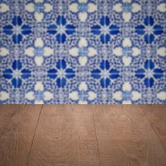 Image showing Wood table top and blur vintage ceramic tile pattern wall