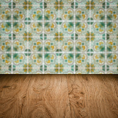 Image showing Wood table top and blur vintage ceramic tile pattern wall