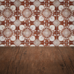 Image showing Wood table top and blur vintage ceramic tile pattern wall