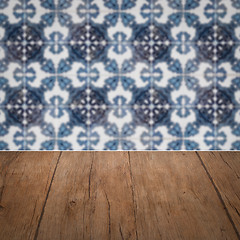 Image showing Wood table top and blur vintage ceramic tile pattern wall