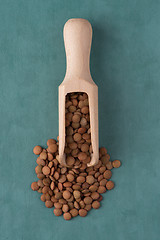 Image showing Wooden scoop with lentils