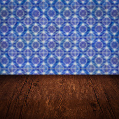 Image showing Wood table top and blur vintage ceramic tile pattern wall