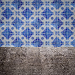 Image showing Wood table top and blur vintage ceramic tile pattern wall