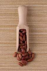 Image showing Wooden scoop with red beans