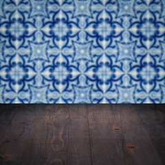 Image showing Wood table top and blur vintage ceramic tile pattern wall